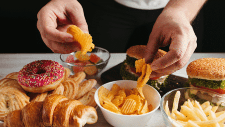 A picture containing food, person